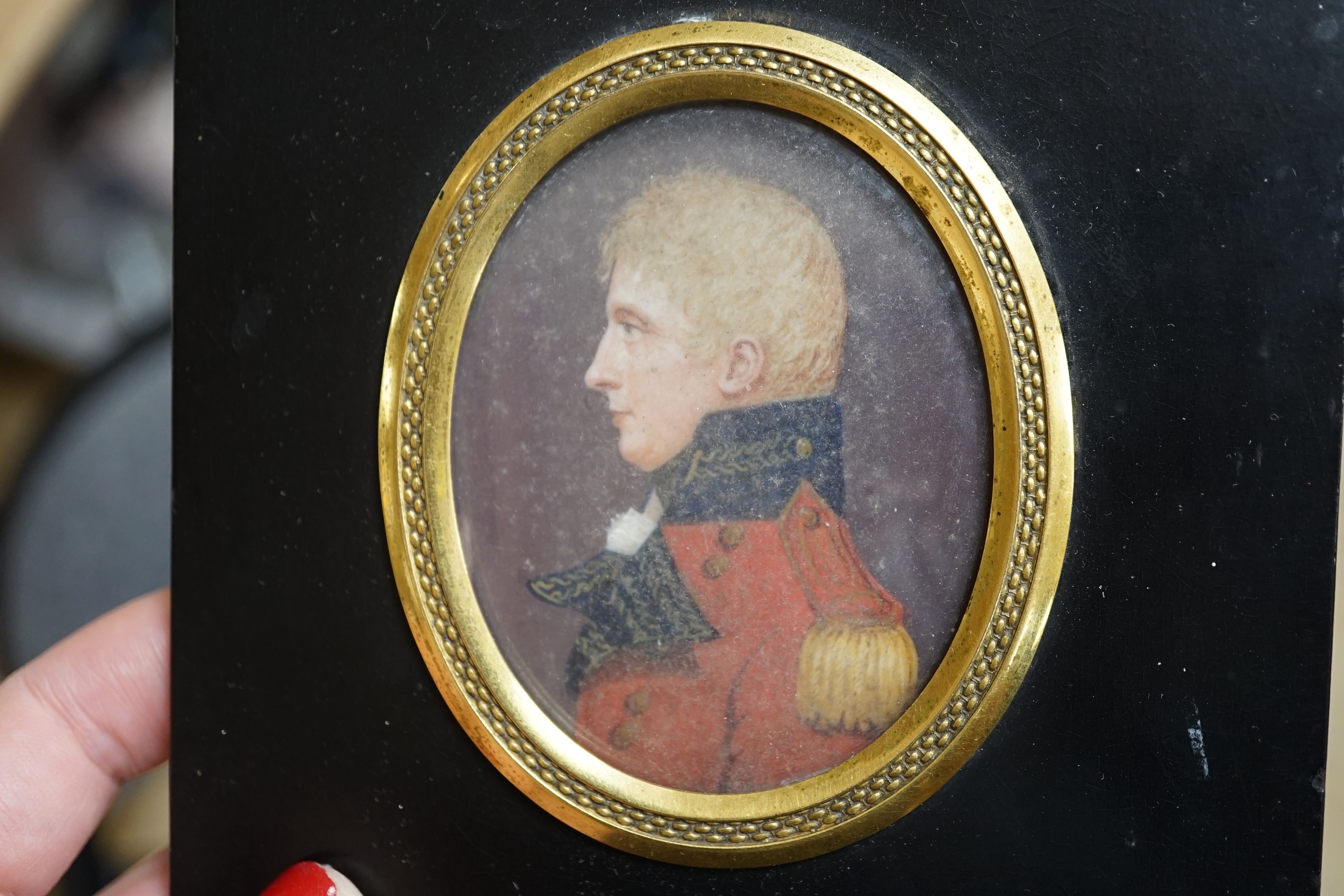 J.T. Mitchell (19th. C), set of four family portrait miniatures on ivory, including a gentleman wearing military uniform, various ink inscriptions verso, 7 x 5cm. CITES Submission reference SG9FKQRE. Condition - fair